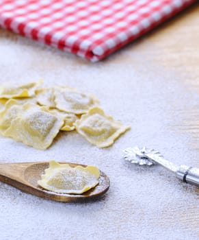 Preparing fresh ravioli at the kitchen table.