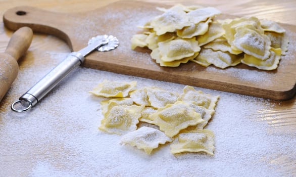 Preparing fresh ravioli at the kitchen table.