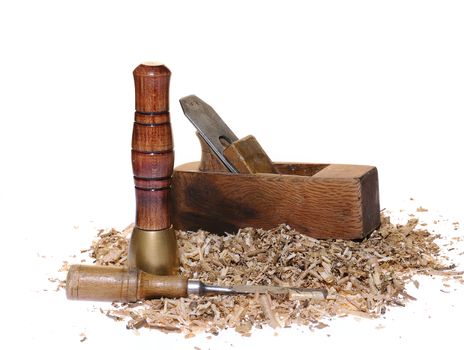 Finishing instruments and sawdust on white background. Isolated
