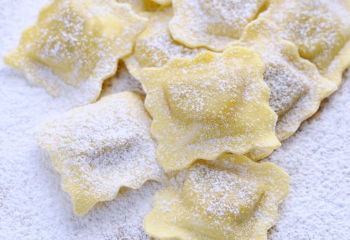 Preparing fresh ravioli at the kitchen table.