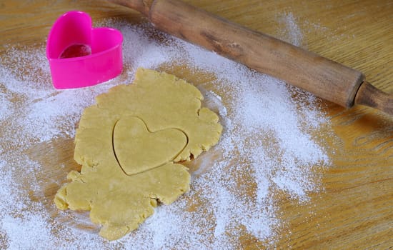 Homemade cookies for valentines day over wooden table