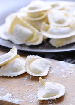 Preparing fresh ravioli at the kitchen table.