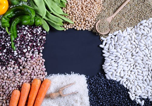 Legumes on wooden table in the kitchen