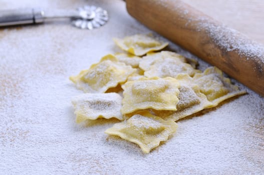 Preparing fresh ravioli at the kitchen table.