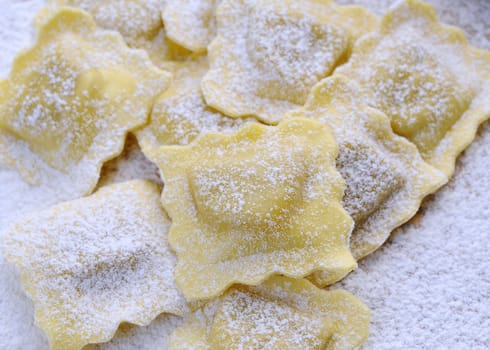 Preparing fresh ravioli at the kitchen table.