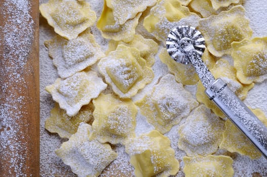 Preparing fresh ravioli at the kitchen table.