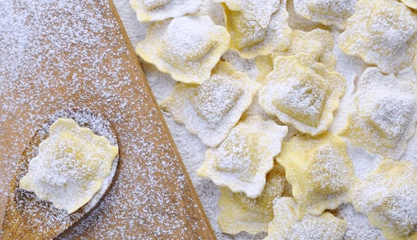 Preparing fresh ravioli at the kitchen table.