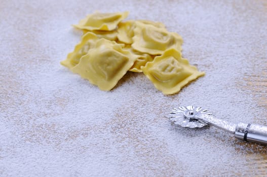 Preparing fresh ravioli at the kitchen table.