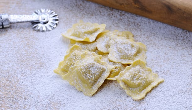 Preparing fresh ravioli at the kitchen table.
