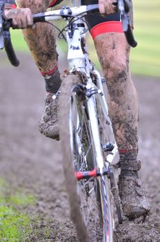 Detail bicycle chain with mud in a race