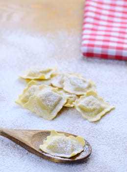 Preparing fresh ravioli at the kitchen table.