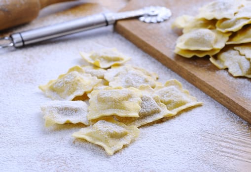 Preparing fresh ravioli at the kitchen table.
