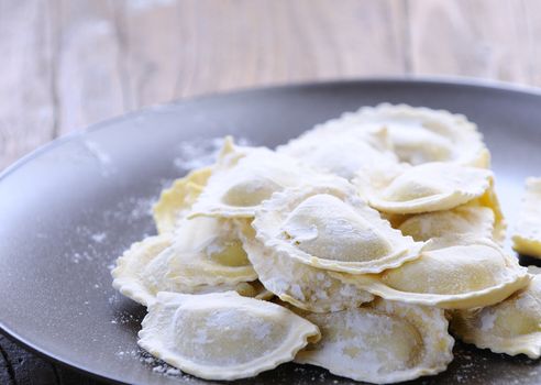Preparing fresh ravioli at the kitchen table.