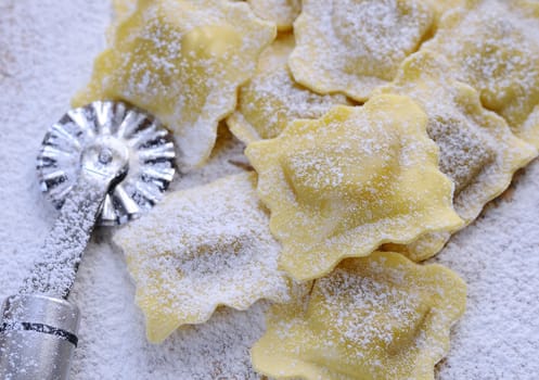 Preparing fresh ravioli at the kitchen table.