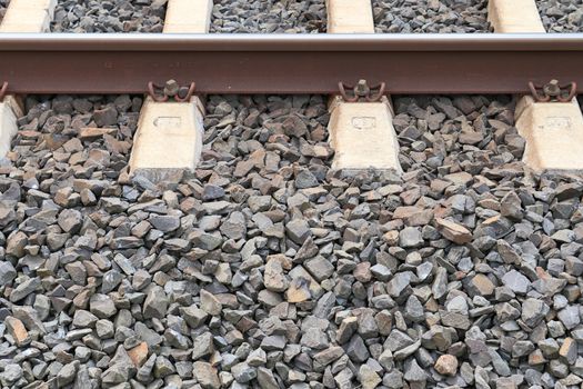 Multiple railroad tracks with junctions at a railway station in a perspective view