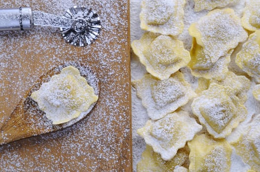 Preparing fresh ravioli at the kitchen table.
