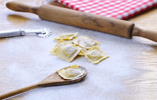Preparing fresh ravioli at the kitchen table.