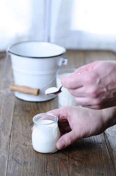 Homemade yogurt on wooden table in the kitchen