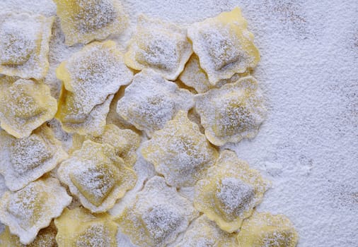 Preparing fresh ravioli at the kitchen table.