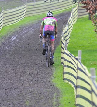 Unidentified cyclist compete in cycle race of cyclocross