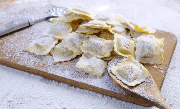 Preparing fresh ravioli at the kitchen table.