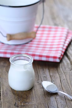 Homemade yogurt on wooden table in the kitchen