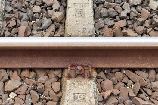 Multiple railroad tracks with junctions at a railway station in a perspective view