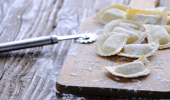 Preparing fresh ravioli at the kitchen table.