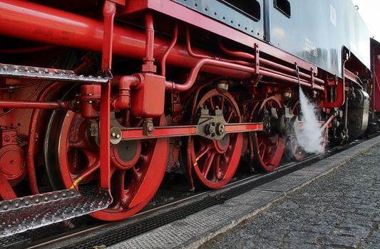 Multiple railroad tracks with junctions at a railway station in a perspective view