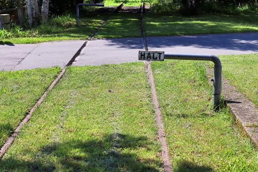 Multiple railroad tracks with junctions at a railway station in a perspective view