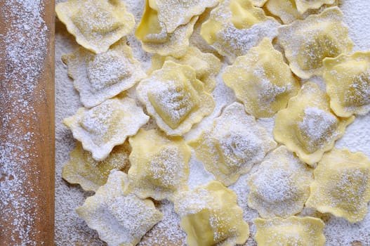 Preparing fresh ravioli at the kitchen table.