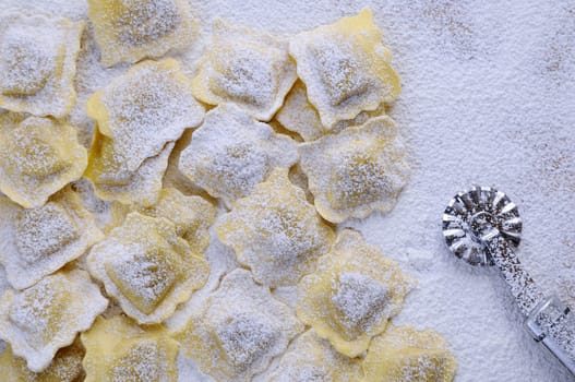 Preparing fresh ravioli at the kitchen table.