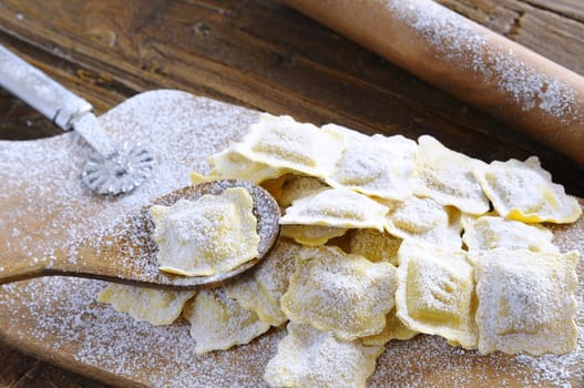 Preparing fresh ravioli at the kitchen table.