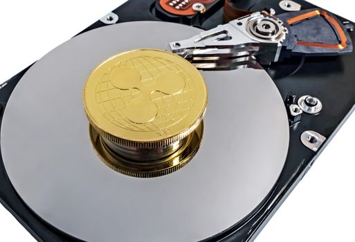 Physical Coin Cryptocurrency Ripple XRP Gold Plated Bitcoin in laptop hard disk server network concept. Crypto currency blockchain Coin virtual money concept isolated on white background.