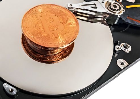 Physical Coin Cryptocurrency BTC Gold Plated Bitcoin in laptop hard disk server. Crypto currency blockchain Coin virtual money concept isolated on white background.