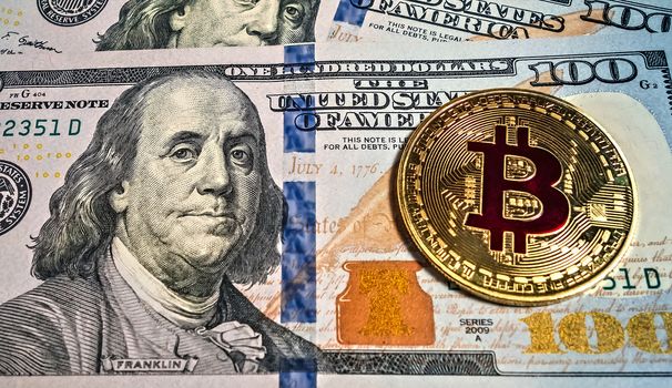 Gold bitcoin coin Macro portrait of Benjamin Franklin of dollar bills background cryptocurrency mining concept.