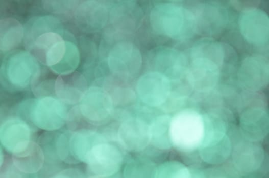 Turquoise colored abstract background with bokeh, for the new year and christmas