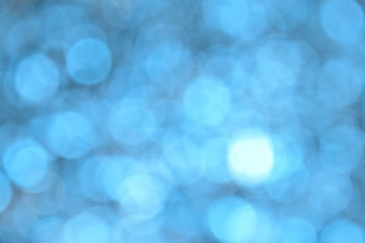 Blue colored abstract background with bokeh, for the new year and christmas