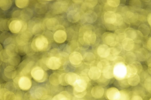 Yellow colored abstract background with bokeh, for the new year and christmas