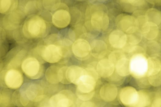 Yellow colored abstract background with bokeh, for the new year and christmas