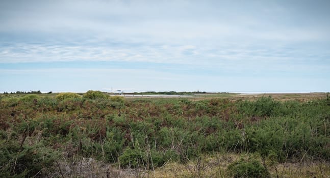 Port Joinville, France - September 16, 2018 small plane that maneuver on an airfield in the island of Yeu near France an autumn day