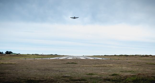 Port Joinville, France - September 16, 2018: Small passenger plane taking off from an airfield on Yeu Island near France on a fall day