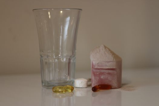 Pile of cocoa protein powder isolated over the white background