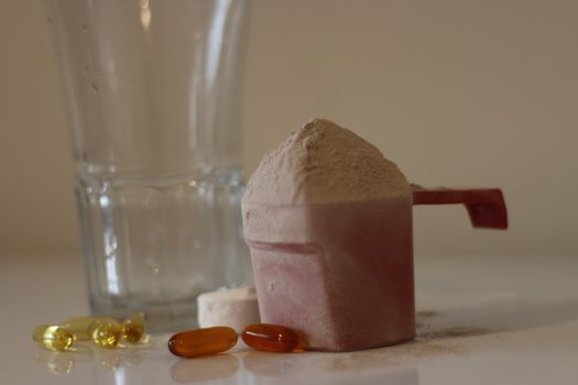 Pile of cocoa protein powder isolated over the white background