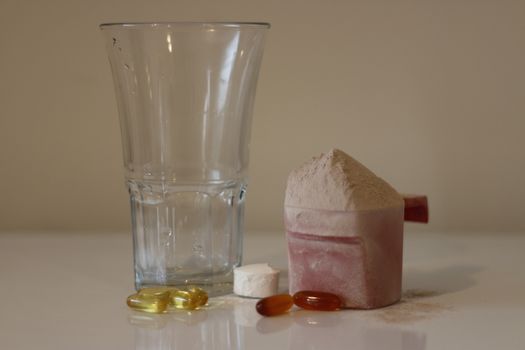 Pile of cocoa protein powder isolated over the white background