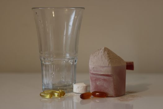 Pile of cocoa protein powder isolated over the white background