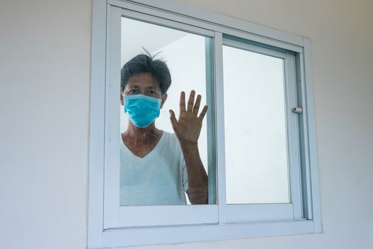 Man in isolation at home for coronavirus outbreak (COVID-19), Quarantine to prevent the spread of the coronavirus (COVID-19)