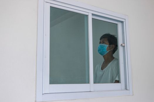 Man in isolation at home for coronavirus outbreak (COVID-19), Quarantine to prevent the spread of the coronavirus (COVID-19)