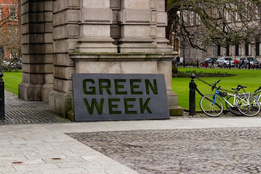 a sign promoting green week at the trinity university college