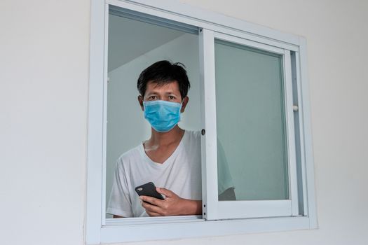 Man in isolation at home for coronavirus outbreak (COVID-19), Quarantine to prevent the spread of the coronavirus (COVID-19)